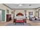 Main bedroom with natural lighting, with comfortable seating, and large bed at 3717 Tigereye Ct, Mulberry, FL 33860