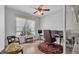 Bright office space with wood floors, ceiling fan, and large window at 3717 Tigereye Ct, Mulberry, FL 33860