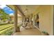 Relaxing screened patio with outdoor seating that overlooks lush landscaping and open sky views at 3717 Tigereye Ct, Mulberry, FL 33860
