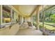 The covered, screened patio offers views of the outdoor kitchen and the landscaped backyard at 3717 Tigereye Ct, Mulberry, FL 33860
