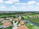 Wonderful aerial view showcasing the neighborhood's proximity to the golf course, nature, and water views at 4105 Limerick Dr, Lake Wales, FL 33859