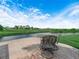 Charming outdoor patio with comfortable seating overlooking a serene view of the lake and lush greenery at 4105 Limerick Dr, Lake Wales, FL 33859