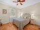 This bedroom includes a ceiling fan, wood floors, and an exterior window for lots of natural light at 4105 Limerick Dr, Lake Wales, FL 33859
