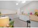 Bright bonus room with desk, carpeted floors, skylight, and vaulted ceilings at 4105 Limerick Dr, Lake Wales, FL 33859