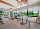 Spacious Florida room featuring tile floors, beamed ceilings, many windows and views of the outdoors at 4105 Limerick Dr, Lake Wales, FL 33859