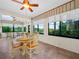 Bright and airy Florida room with large windows and views of the surrounding landscape at 4105 Limerick Dr, Lake Wales, FL 33859
