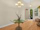 Inviting foyer featuring a unique glass table and chandelier, creating a warm ambiance at 4105 Limerick Dr, Lake Wales, FL 33859