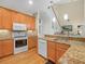 Well-equipped kitchen with modern appliances, granite counters, and easy access to the dining area at 4105 Limerick Dr, Lake Wales, FL 33859
