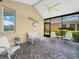 Inviting covered lanai featuring tile floors and comfortable seating, perfect for relaxation and entertaining guests at 4105 Limerick Dr, Lake Wales, FL 33859