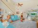 Spacious living room with high ceilings, comfortable seating, and an abundance of natural light at 4105 Limerick Dr, Lake Wales, FL 33859