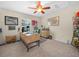 Well-lit office with a large window, vintage decor, carpeted floors, and a ceiling fan at 4105 Limerick Dr, Lake Wales, FL 33859