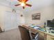 Office featuring a large desk, comfortable chair, carpeted floors and ceiling fan at 4105 Limerick Dr, Lake Wales, FL 33859