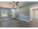 Bright entryway with gray walls, white trim, wood-look floors, and a ceiling fan at 411 Red Hawk Loop, Winter Haven, FL 33880