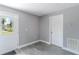 Mudroom with gray walls, white trim, wood-look floors, and an exit door at 411 Red Hawk Loop, Winter Haven, FL 33880