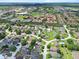 Bird's-eye view of home highlighting its location in a residential community with nearby amenities at 419 Wellesly Dr, Davenport, FL 33897