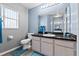 Bathroom with vinyl flooring and vanity with cabinets for storage at 419 Wellesly Dr, Davenport, FL 33897