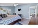 Bedroom features wood flooring, large windows, and neutral colored walls at 419 Wellesly Dr, Davenport, FL 33897