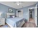 This bedroom offers a closet, light blue walls, and a white bed frame at 419 Wellesly Dr, Davenport, FL 33897