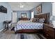 The main bedroom features wood flooring and a ceiling fan at 419 Wellesly Dr, Davenport, FL 33897
