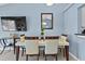 Bright dining area featuring modern furnishings and a view into living space at 419 Wellesly Dr, Davenport, FL 33897