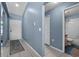 Inviting entryway featuring tile flooring, fresh paint, and access to bathroom at 419 Wellesly Dr, Davenport, FL 33897