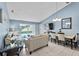 Open-concept living area with tile flooring and dining area with vaulted ceilings at 419 Wellesly Dr, Davenport, FL 33897
