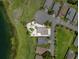 Beautiful aerial view of lakefront property with manicured landscaping and mature trees at 452 Lake Suzanne Dr, Lake Wales, FL 33859
