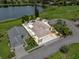 Waterfront home featuring a lovely outdoor space, mature trees and a serene lake view at 452 Lake Suzanne Dr, Lake Wales, FL 33859