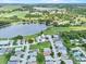 Property showing waterfront homes surrounded by lush greenery and mature trees at 452 Lake Suzanne Dr, Lake Wales, FL 33859