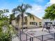 The home's backyard boasts a concrete patio with a swing set and well-maintained landscaping at 452 Lake Suzanne Dr, Lake Wales, FL 33859