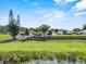 The expansive backyard extends to the water, showcasing a tiered garden at 452 Lake Suzanne Dr, Lake Wales, FL 33859