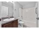 Bathroom featuring a shower-tub combo and a vanity at 452 Lake Suzanne Dr, Lake Wales, FL 33859