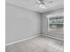 Neutral bedroom featuring tile flooring and a window at 452 Lake Suzanne Dr, Lake Wales, FL 33859