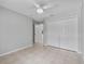 Spacious bedroom featuring tile flooring and a double closet at 452 Lake Suzanne Dr, Lake Wales, FL 33859