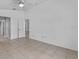 Neutral bedroom featuring tile flooring and a ceiling fan at 452 Lake Suzanne Dr, Lake Wales, FL 33859