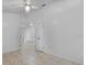 Neutral bedroom features tile flooring and a ceiling fan for added comfort at 452 Lake Suzanne Dr, Lake Wales, FL 33859