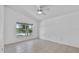 Bright bedroom with tile flooring and lake views at 452 Lake Suzanne Dr, Lake Wales, FL 33859