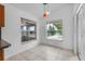 Bright dining area with tile flooring and views of the yard at 452 Lake Suzanne Dr, Lake Wales, FL 33859