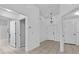 Inviting home foyer featuring neutral tile flooring, arched doorway, and a view to the front entry at 452 Lake Suzanne Dr, Lake Wales, FL 33859