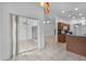 Open-concept kitchen features tile flooring and view to sunroom with a gas range at 452 Lake Suzanne Dr, Lake Wales, FL 33859