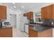 Well-equipped kitchen with tile flooring, dark countertops and white appliances at 452 Lake Suzanne Dr, Lake Wales, FL 33859
