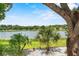 Scenic view of the serene lake showcasing the natural beauty of the waterfront property at 452 Lake Suzanne Dr, Lake Wales, FL 33859