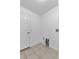 Small laundry room has tile floor and utility connections at 452 Lake Suzanne Dr, Lake Wales, FL 33859