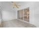 Enclosed sunroom features tile flooring and sliding glass doors at 452 Lake Suzanne Dr, Lake Wales, FL 33859