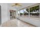 Sunroom with tile floors and windows with lake view at 452 Lake Suzanne Dr, Lake Wales, FL 33859