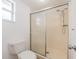 Bathroom featuring a sliding glass shower door, and a commode at 455 Manor Dr, Bartow, FL 33830