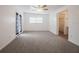 Large bedroom featuring neutral tones, carpeted floors, and natural light at 455 Manor Dr, Bartow, FL 33830