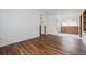 Bright and spacious living room with gleaming wood floors and fresh white walls at 455 Manor Dr, Bartow, FL 33830