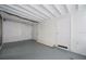 Bright room with white-painted brick walls, concrete floor, and white-painted rafter ceiling at 455 Manor Dr, Bartow, FL 33830