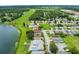 An aerial view of a well-maintained community with waterfront homes along a lake at 464 Lake Suzanne Dr, Lake Wales, FL 33859
